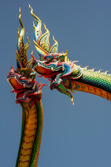 Udon Thani, Thailand - 21 June 2021 : Close-up Twin Stucco painted as a large serpent at Pra kai keaw wang nakin, Located at Ban Don swan, Phen District, Udon Thani, Thailand.