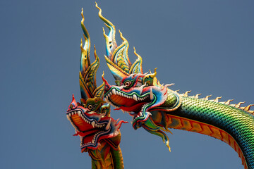 Wall Mural - Udon Thani, Thailand - 21 June 2021 : Close-up Twin Stucco painted as a large serpent at Pra kai keaw wang nakin, Located at Ban Don swan, Phen District, Udon Thani, Thailand.