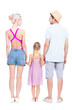 © Mediaphotos - Vertical full length studio portrait of family with one little daughter wearing summer outfits spending time on vacation, white background