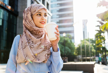 Sticker - Muslim woman drinking coffee in the city