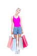 © Mediaphotos - Vertical full length studio portrait of stylish young woman wearing summer outfit carrying shopping bags, white background