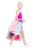 © Mediaphotos - Vertical full length studio portrait of stylish young woman wearing summer outfit carrying shopping bags, white background