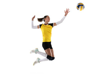 Female professional volleyball player with ball isolated on white studio background. The athlete, exercise, action, sport, healthy lifestyle, training, fitness concept.