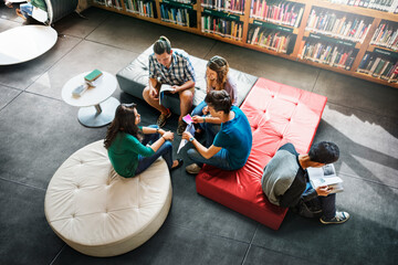 Canvas Print - Young students at the school library