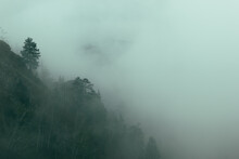 Silhouette Of The Mountain In The Fog