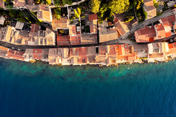 Poster - Aerial view old buildings and old houses on the water's edge at Rovinj Adriatic Sea in Croatia