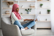 © Prostock-studio - Remote Job. Black Muslim Lady In Hijab Working With Laptop At Home