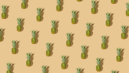 Creative summer vibes concept with fresh raw pineapple on pastel beige background. Minimalistic geometric pattern arrangement. Healthy food and tropical fruit idea.