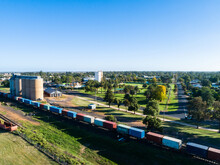 Aussie Country Town Scene In Narromine Of Grain Silos Beside Railway And Freight Train
