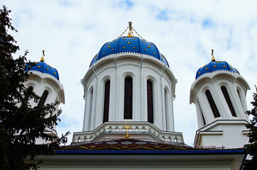 Picturesque landscape view of Saint Nicholas Church in Chernivtsi. Blue sky background. Built in the Romanian style neorominesk. Orthodox church in Chernivtsi, Bukovina, Ukraine