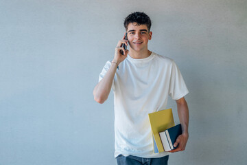 Poster - teenage student with books and mobile phone