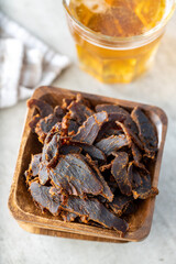 Canvas Print - Sliced beef jerky. Dried beef meat.