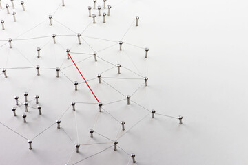 Wall Mural - Linking entities. Hotline, VPN, tunneling, dedicated line, Network, networking, social media, connectivity, internet communication abstract. Fat red wire in a web of silver wires on white background.