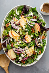 Wall Mural - Winter salad with apple and pecans with vinaigrette dressing