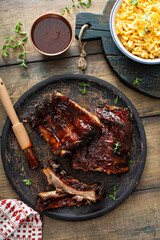 Wall Mural - Grilled barbeque ribs with BBQ sauce and sides