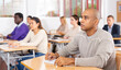 © JackF - Small group of students attentively listening to lecture in classroom