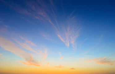 Wall Mural - beautiful sky painted by the sun leaving bright golden shades.dense clouds in twilight sky in winter