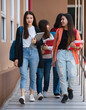 © Bangkok Click Studio - Group of young attractive asian girls college students walking together in university campus smiling and laughing with joy. Concept for education and college students life