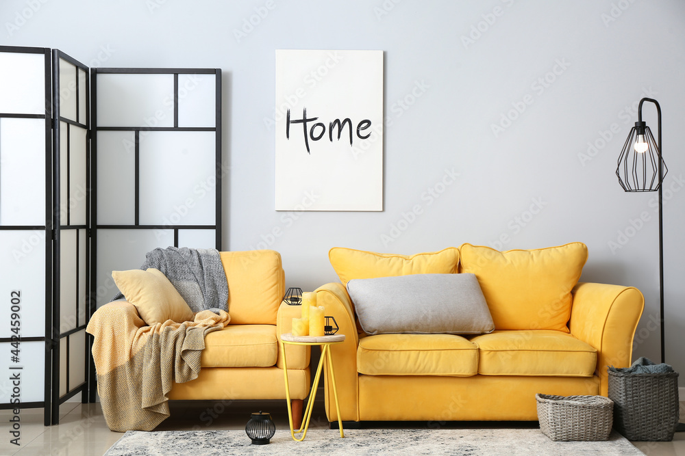 Interior of stylish living room with comfortable sofa - obrazy, fototapety, plakaty 