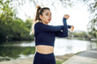 © fotofabrika - Fit young girl in dark blue sportswear exercising in park