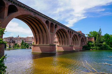 Albi old red brick stone bridge over the Tarn river in France