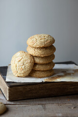 Tahini cookies on wooden table with old book 