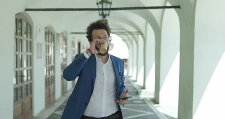 Poster - confident smart casual man holding and drinking coffee, looking to side, holding telephone and checking emails, laughing and walking outside