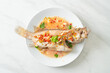 Steamed grouper fish with lime and chillies