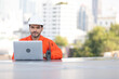 © offsuperphoto - engineer or technician using laptop computer on solar panels on the top of the roof