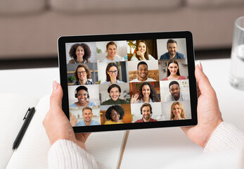 Wall Mural - Unrecognizable Woman Holding Digital Tablet With Group Video Chat Interface On Screen