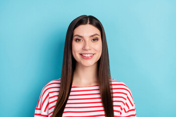 Canvas Print - Portrait of attractive cheerful long-haired girl freelancer wearing striped pullover isolated over bright blue color background