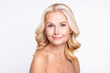 © deagreez - Portrait of attractive cheery grey-haired woman with pure clean clear smooth tanned skin isolated over white color background