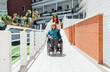 © ADDICTIVE STOCK - Aged mother in wheelchair and daughter during walk