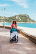 © ADDICTIVE STOCK - Daughter pushing wheelchair with aged mother on embankment
