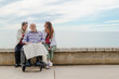 © ADDICTIVE STOCK - Cheerful family with father in wheelchair