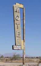 Abandoned Motel Sign In The Desert
