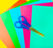 multicolored colored paper with scissors