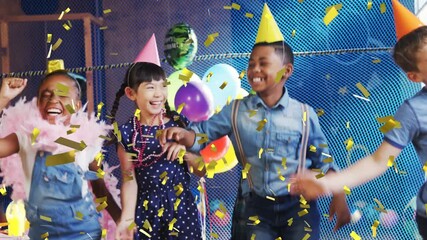 Poster - Animation of gold confetti over diverse happy children having fun dancing at party