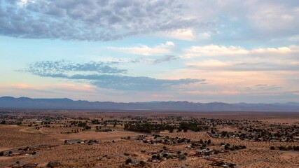 Wall Mural - California City in the heart of the Mojave Desert in this high altitude time lapse with a dynamic cloudscape overhead