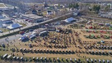An Aerial View Of An Amish Mud Sale Selling Buggies, Quilts And Other Amish Crafts