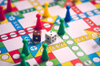 © jaturonoofer - Close up dice on board game using for business strategy concept