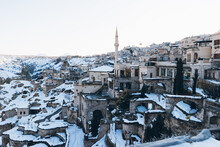 Solitary Old Town With Tall Round Tower In Snowy Valley