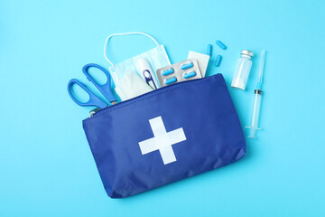 First aid medical kit on blue background