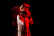 © ADDICTIVE STOCK - Astronaut in space suit standing in red neon light