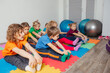 © oksix - Children exercising while physical education lesson at preschool