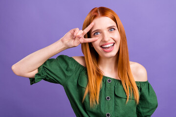 Photo of sweet charming young lady wear green blouse v-sign cover eye smiling isolated purple color background