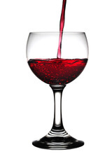 Red wine pour into the glass on white background