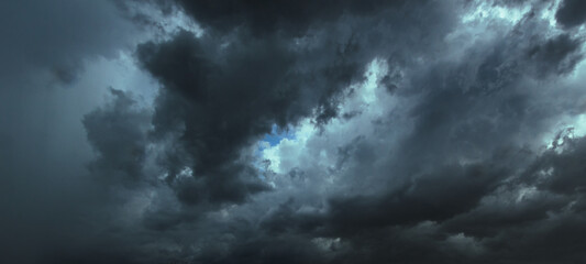 Wall Mural - The dark sky had clouds gathered to the left and a strong storm before it rained.Bad or moody weather sky.