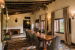 © ADDICTIVE STOCK - Dining room with wooden furniture and curtains on windows