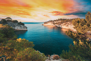 Wall Mural - Cassis, Calanques, France. French Riviera. Beautiful Nature Of Cote De Azur On The Azure Coast Of France. Calanques - A Deep Bay Surrounded By High Cliffs. Altered Sunset Sky. Elevated View